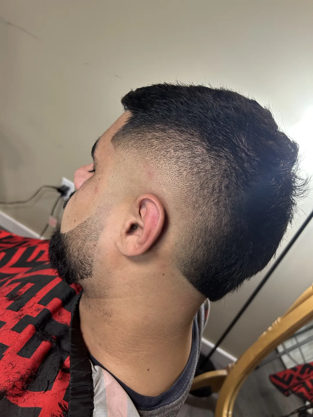 Burst fade with textured top and blended beard — cut at Studio K, Guelph